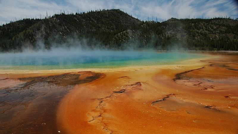 grand prismatic spring showing a rainbow of biologically-based colors in the geothermally heated pool